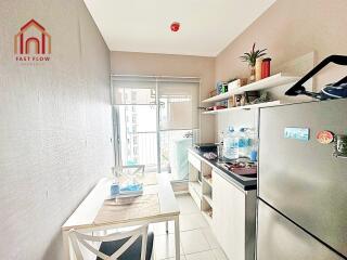 Modern kitchen with dining area and balcony