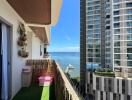 Cozy balcony with view of the ocean and neighboring buildings