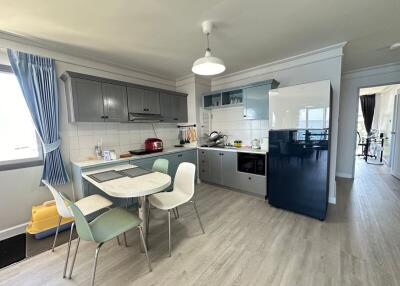 Modern kitchen with dining area and appliances