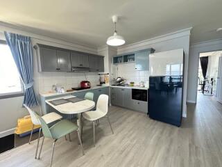 Modern kitchen with dining area and appliances