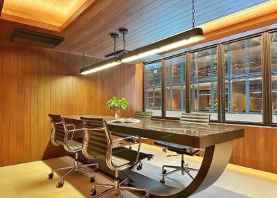 Modern office space with wooden paneling and large window.