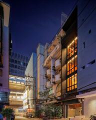 Night view of a building exterior with illuminated windows