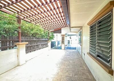 Covered outdoor patio with wooden lattice roof