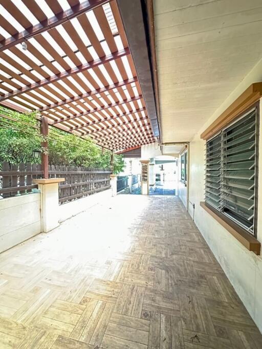 Covered outdoor patio with wooden lattice roof