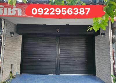 two car garage with black doors