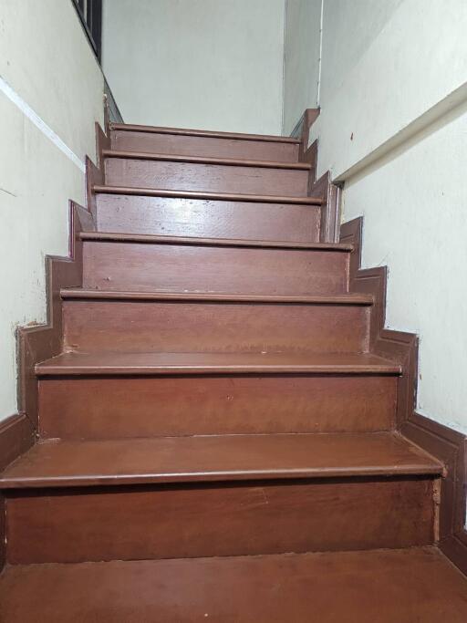 Wooden stairs leading to an upper floor