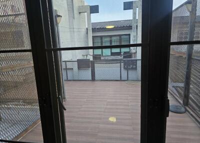 Balcony view with ceramic flooring and metal railing