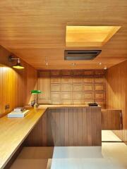 well-lit home office with wooden interiors and bright lighting