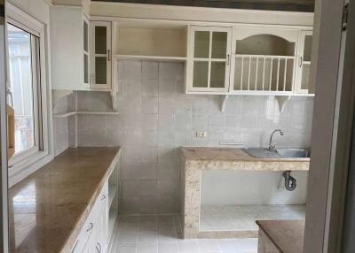 Modern kitchen with cabinets, countertop, and sink