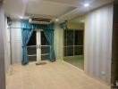 Living room with striped wallpaper, recessed lighting, air conditioning unit, and glass doors