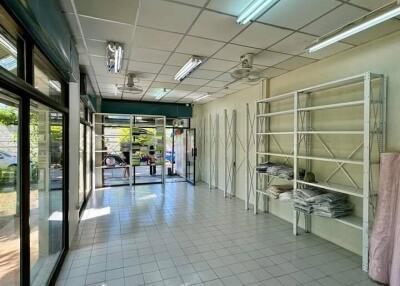 Empty room with shelves and large windows