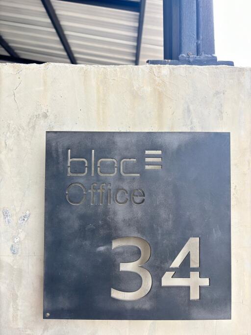 Building entrance with bloc office sign for suite 34