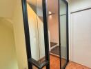 Modern stairwell with glass panels and wooden flooring