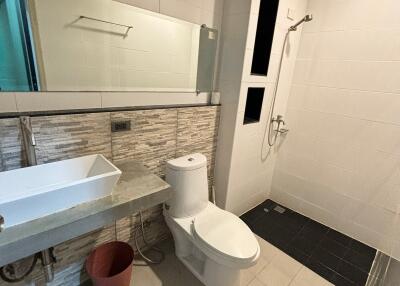 Modern bathroom with shower and vanity