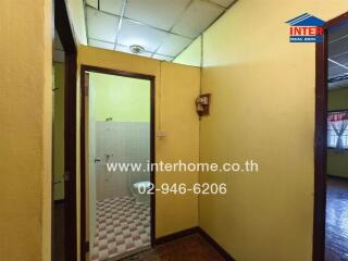 Interior space with a bathroom and adjoining room