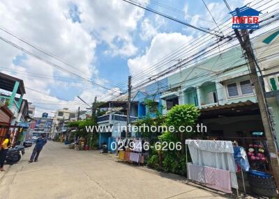 Street view with residential buildings and power lines