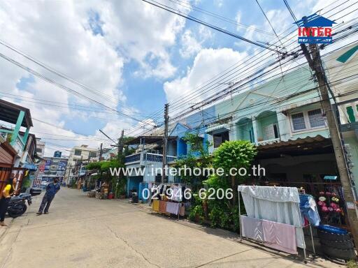 Street view with residential buildings and power lines