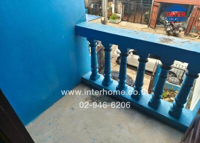 Small balcony with blue railing