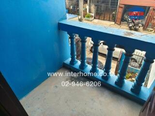 Small balcony with blue railing