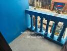 Small balcony with blue railing