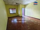 Bedroom with wooden floor and yellow walls