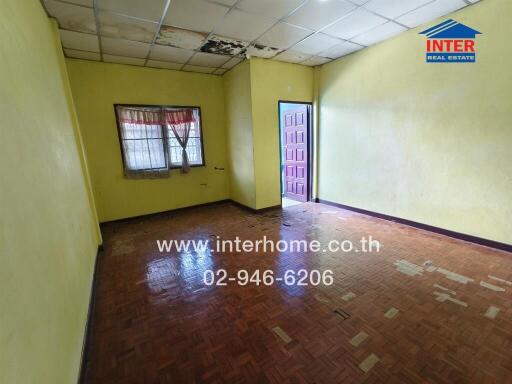 Bedroom with wooden floor and yellow walls