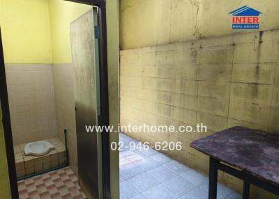 Bathroom and adjoining area with shower and squat toilet