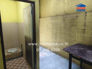 Bathroom and adjoining area with shower and squat toilet