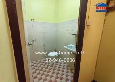 Bathroom with sink and tiled flooring