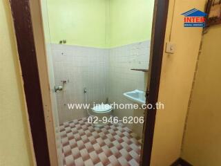 Bathroom with sink and tiled flooring