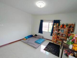 Minimalist bedroom with a folding bed and shelf