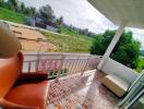 Outdoor balcony with seating and scenic view