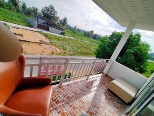 Outdoor balcony with seating and scenic view