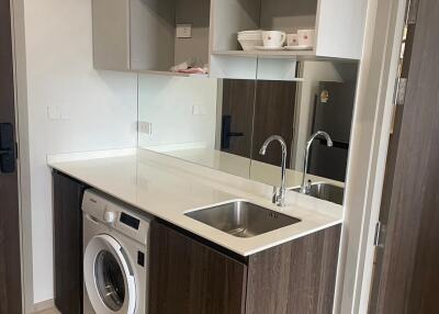 Modern kitchen with washing machine and sink