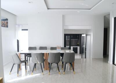 Spacious dining area with a modern table and chairs