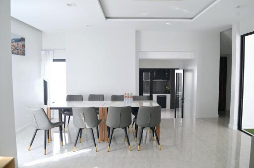 Spacious dining area with a modern table and chairs