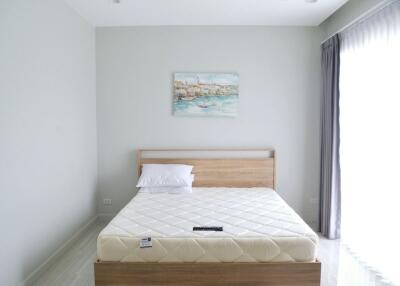 Simple and modern bedroom with bed and painting