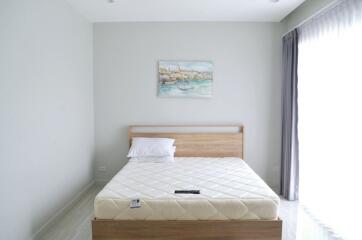 Simple and modern bedroom with bed and painting