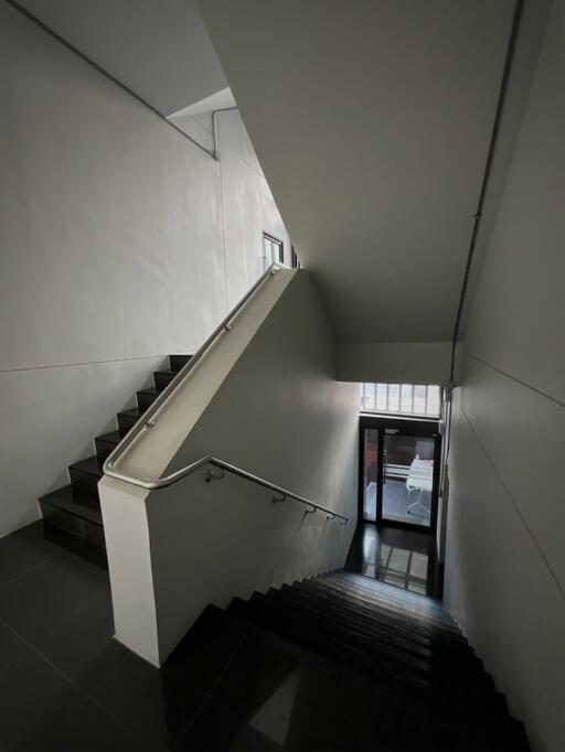 Staircase leading to upper and lower floors