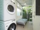 Bright laundry room with stacked washer and dryer