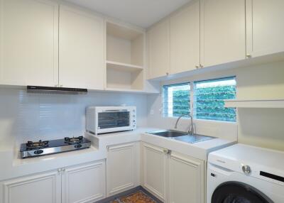 Modern kitchen with white cabinets and appliances