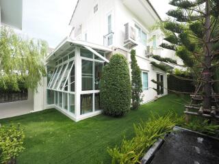 Exterior view of a modern house with a well-maintained garden