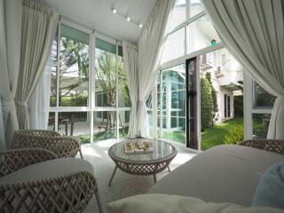 Bright living area with large windows and garden view