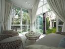 Bright living area with large windows and garden view