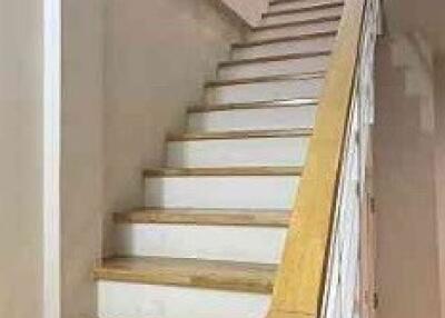 Indoor staircase with wooden handrail