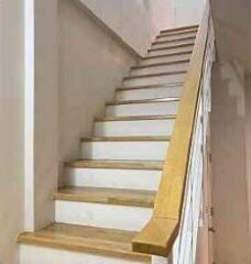 Indoor staircase with wooden handrail