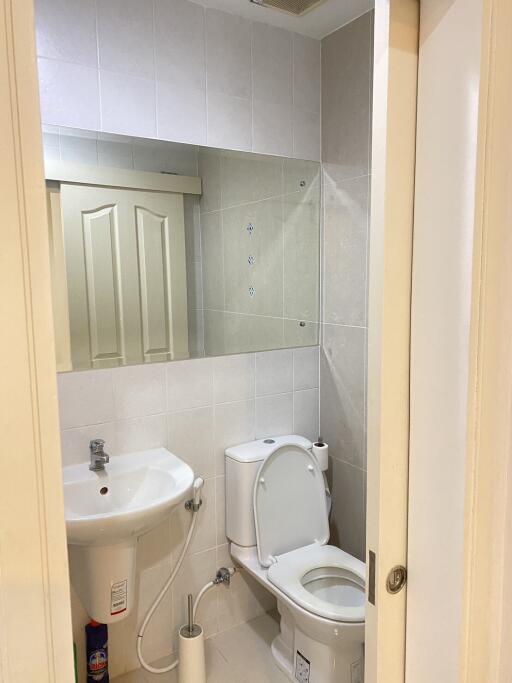 Small bathroom with a sink and toilet