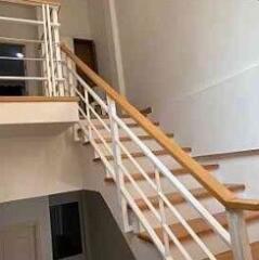 Staircase with railing in a building