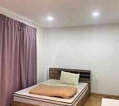 Bedroom with bed and curtains