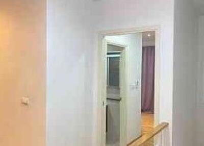 Hallway leading to bathroom and bedroom